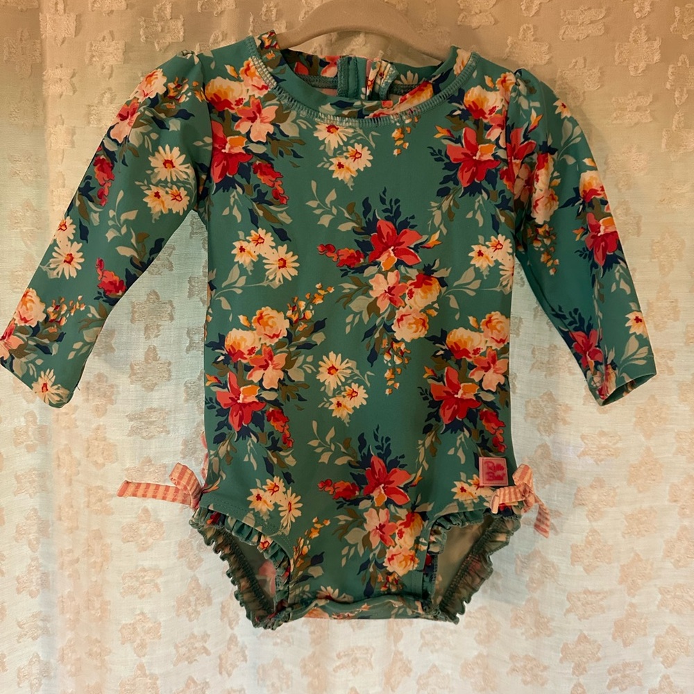 rufflebutts long sleeve upf50 one piece rash guard fancy me floral